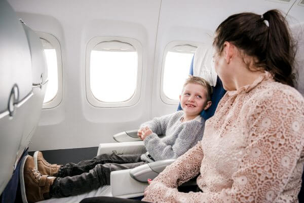 mum and son sitting on plane